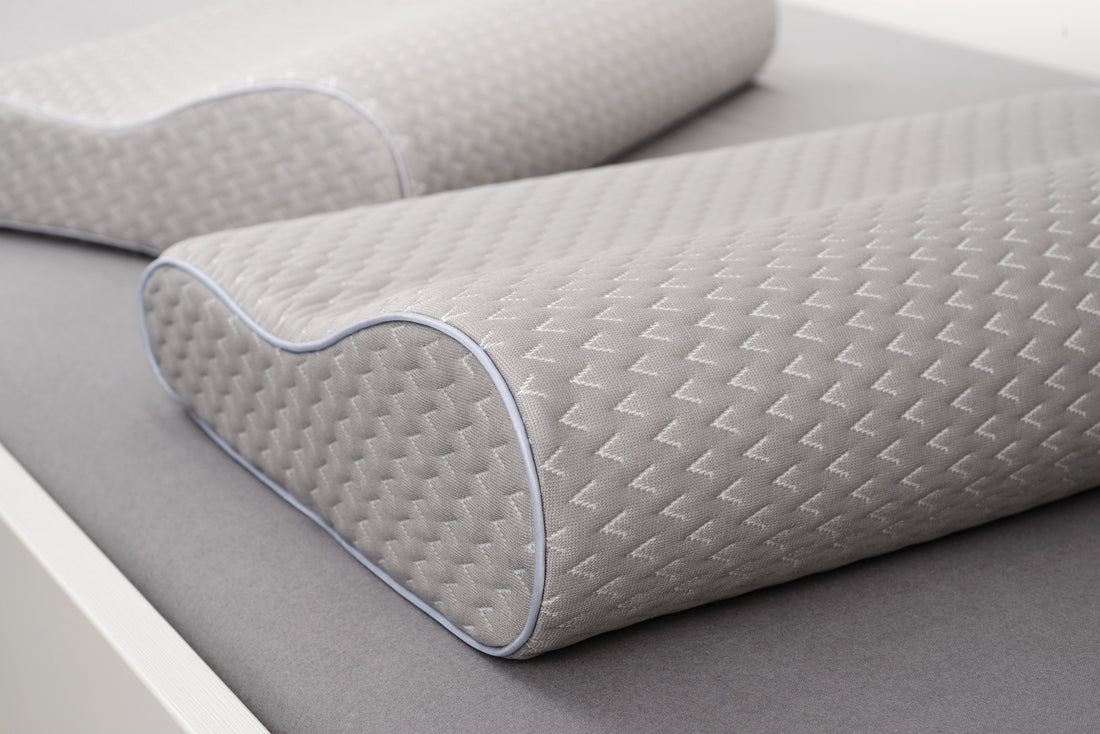 Memory foam pillow providing neck support and sleep comfort