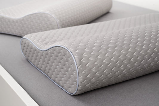 Memory foam pillow providing neck support and sleep comfort