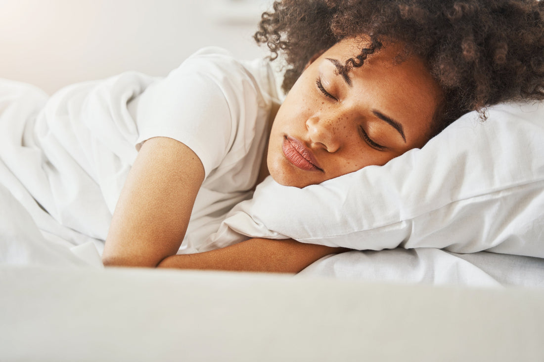 A person peacefully sleeping, with a peaceful and restful night supporting weight loss and metabolism.