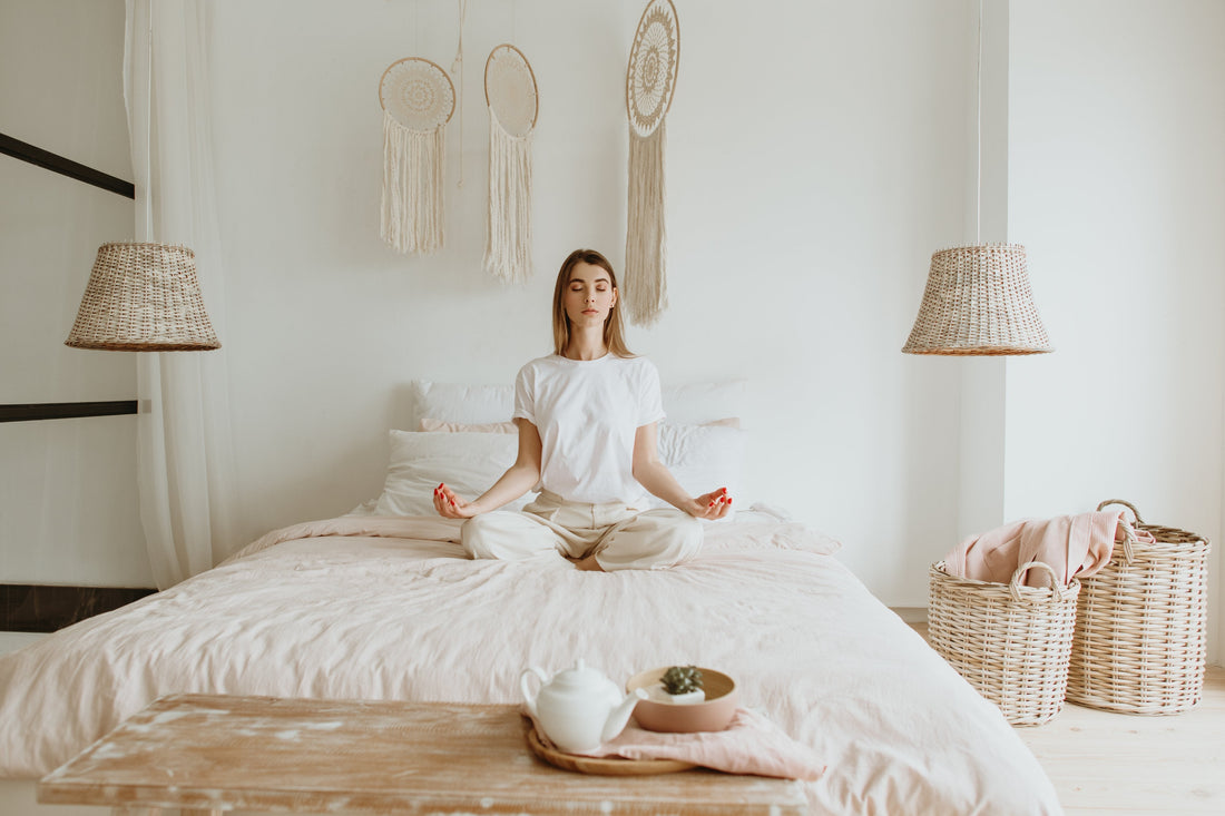 A person relaxing in bed, using relaxation techniques to improve stress and sleep quality.
